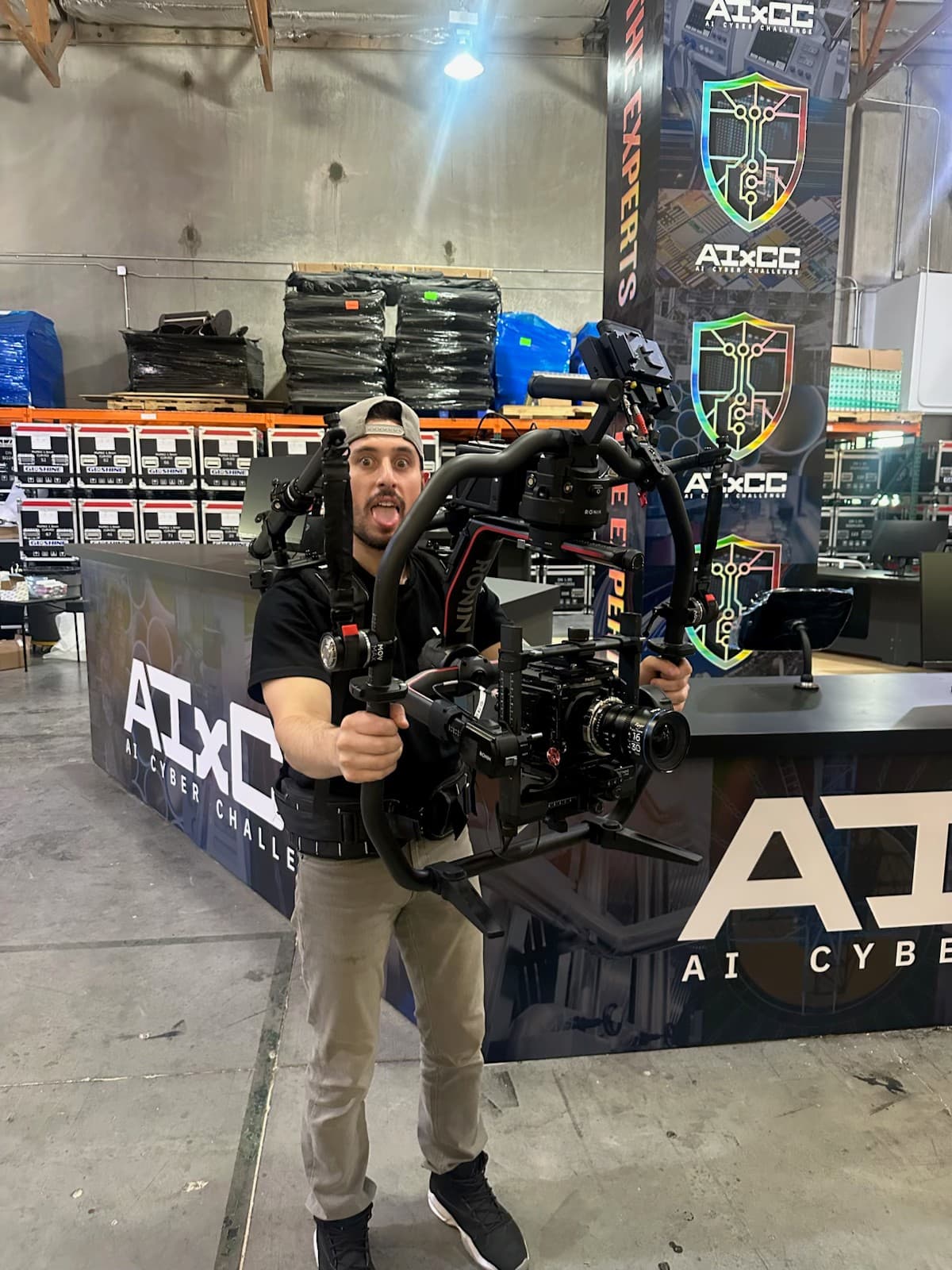 Garrett rigged with a Ronin 2 and support vest at the AIxCC booth