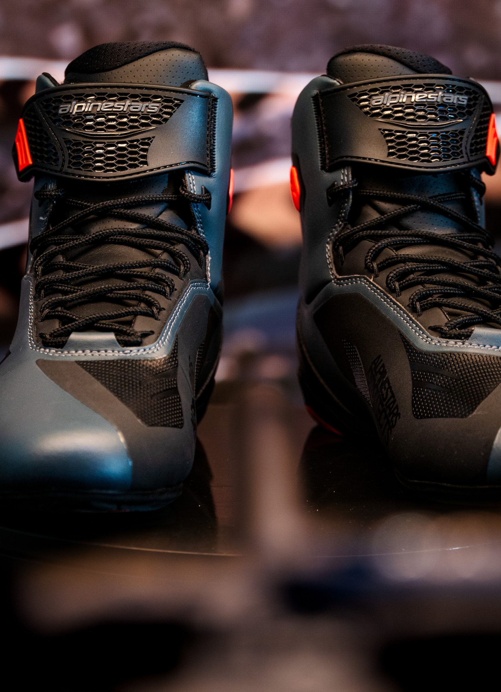 Pair of Alpinestars riding shoes lit in the studio