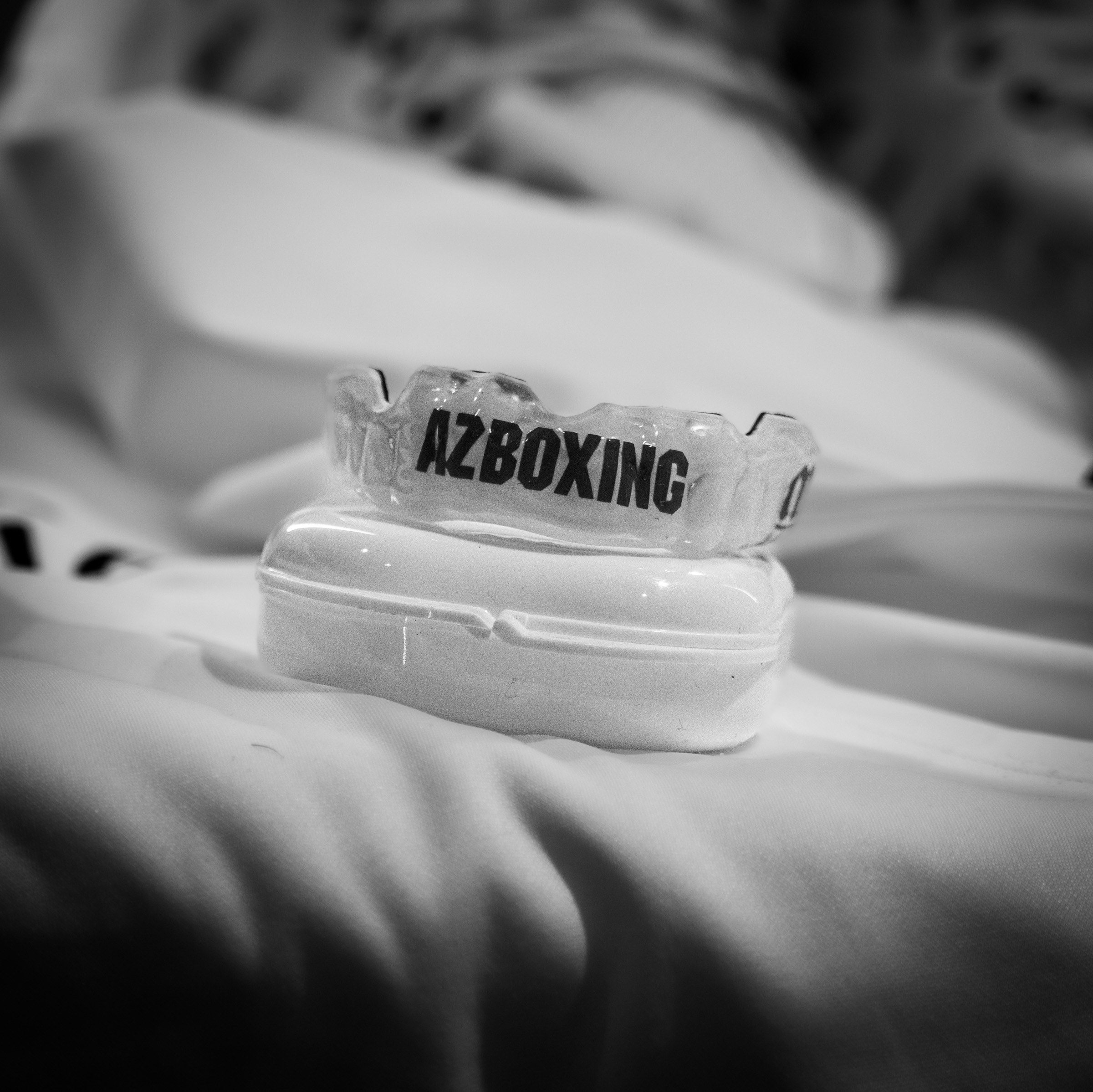 AZ Boxing mouthguard on a white towel, black and white