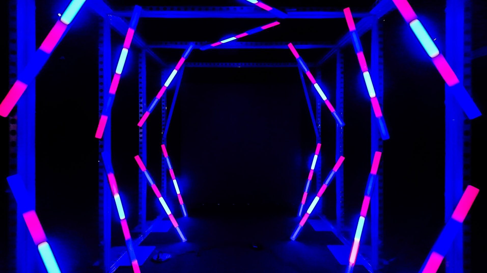Close on the LED tunnel's angled light bars