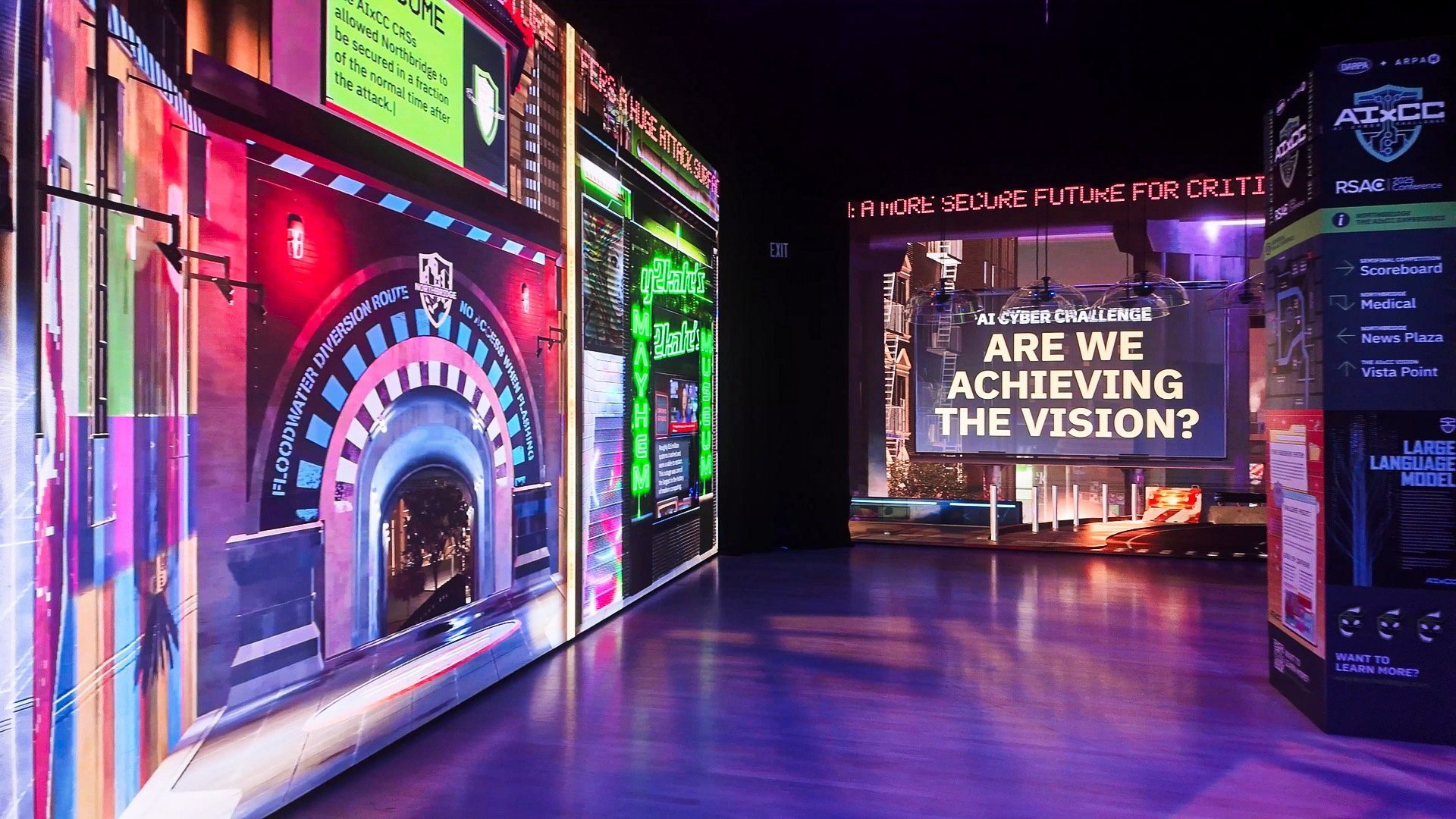 LED tunnel entrance to the AIxCC experience asking "Are we achieving the vision?"