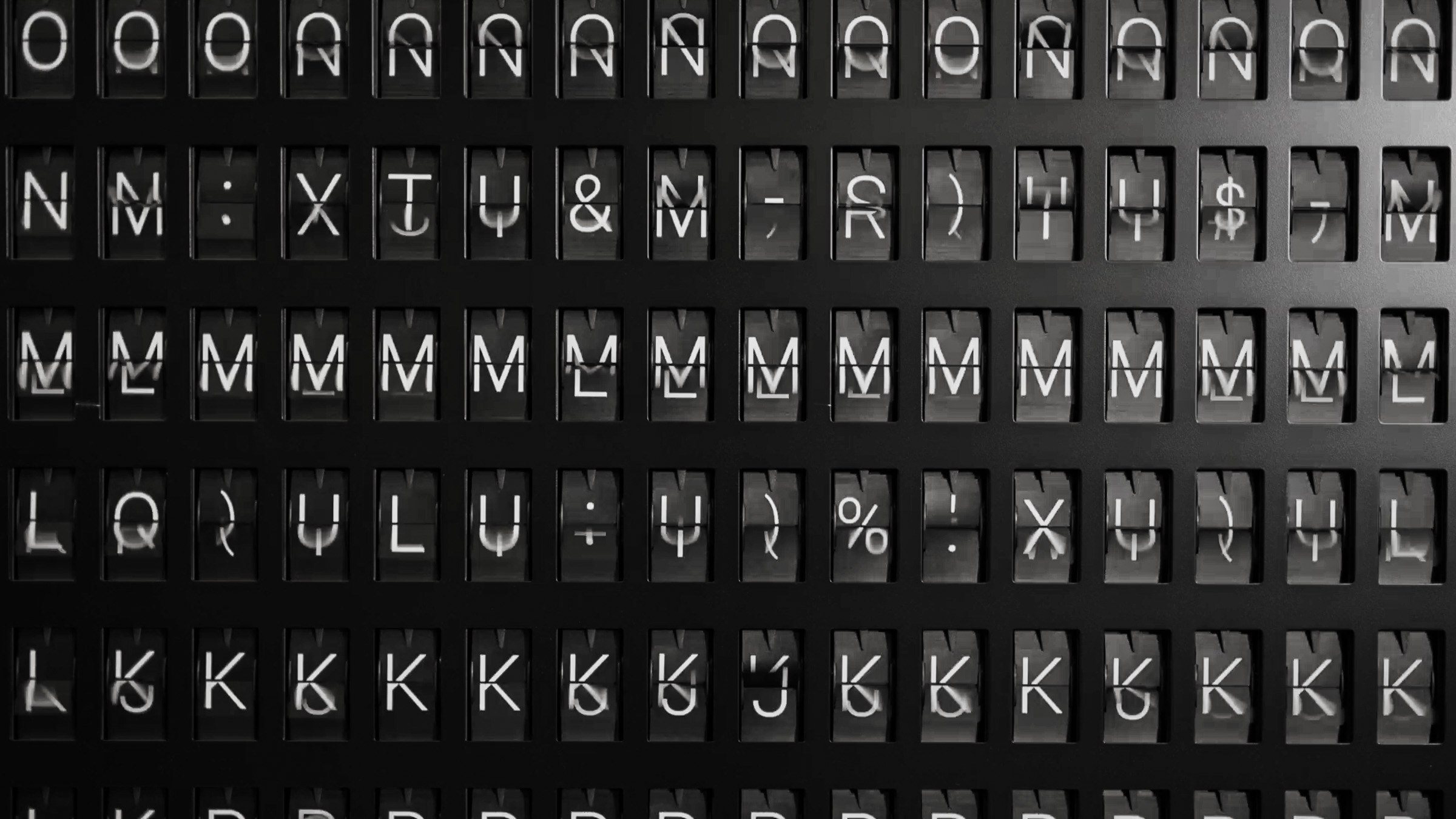 Rows of split-flap display characters