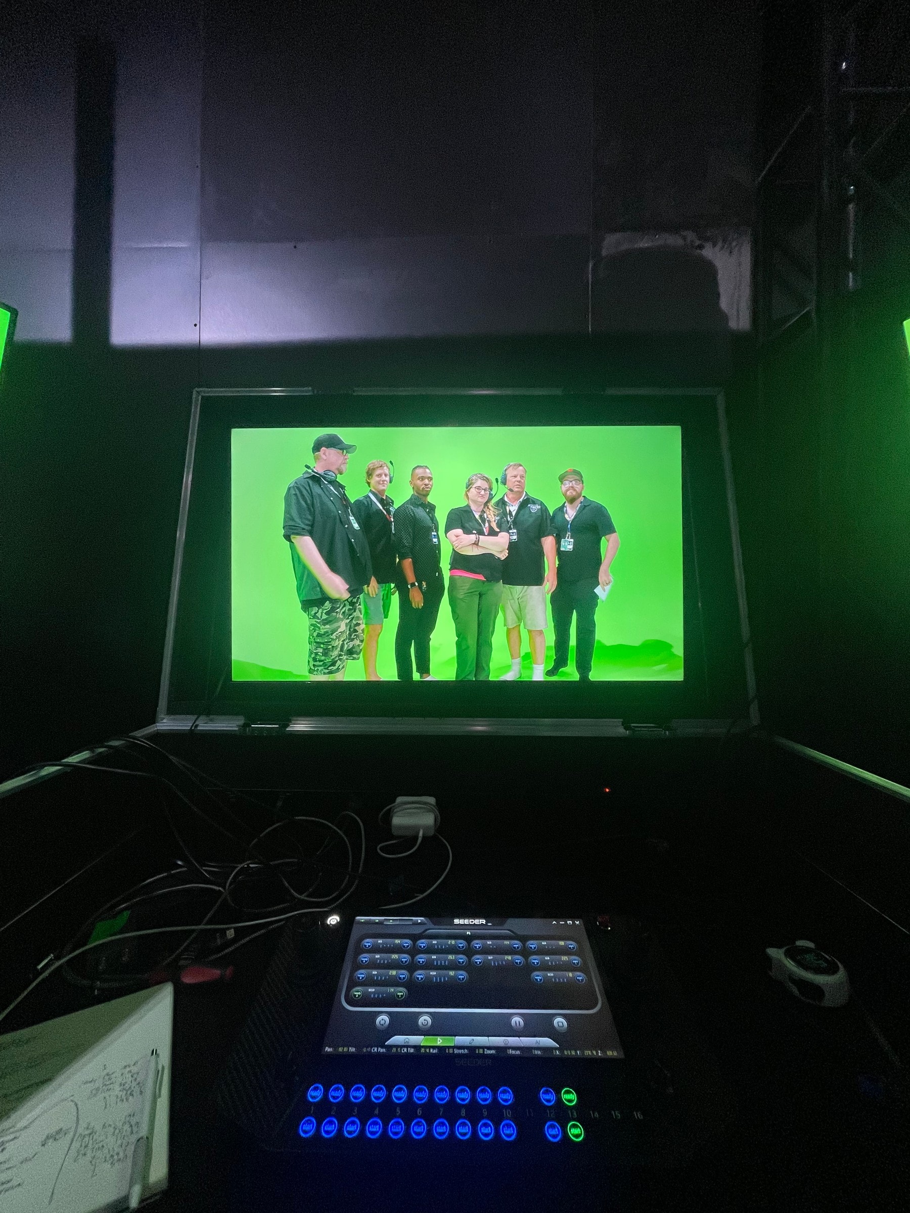 Control room switcher with the program monitor on a group at the green screen