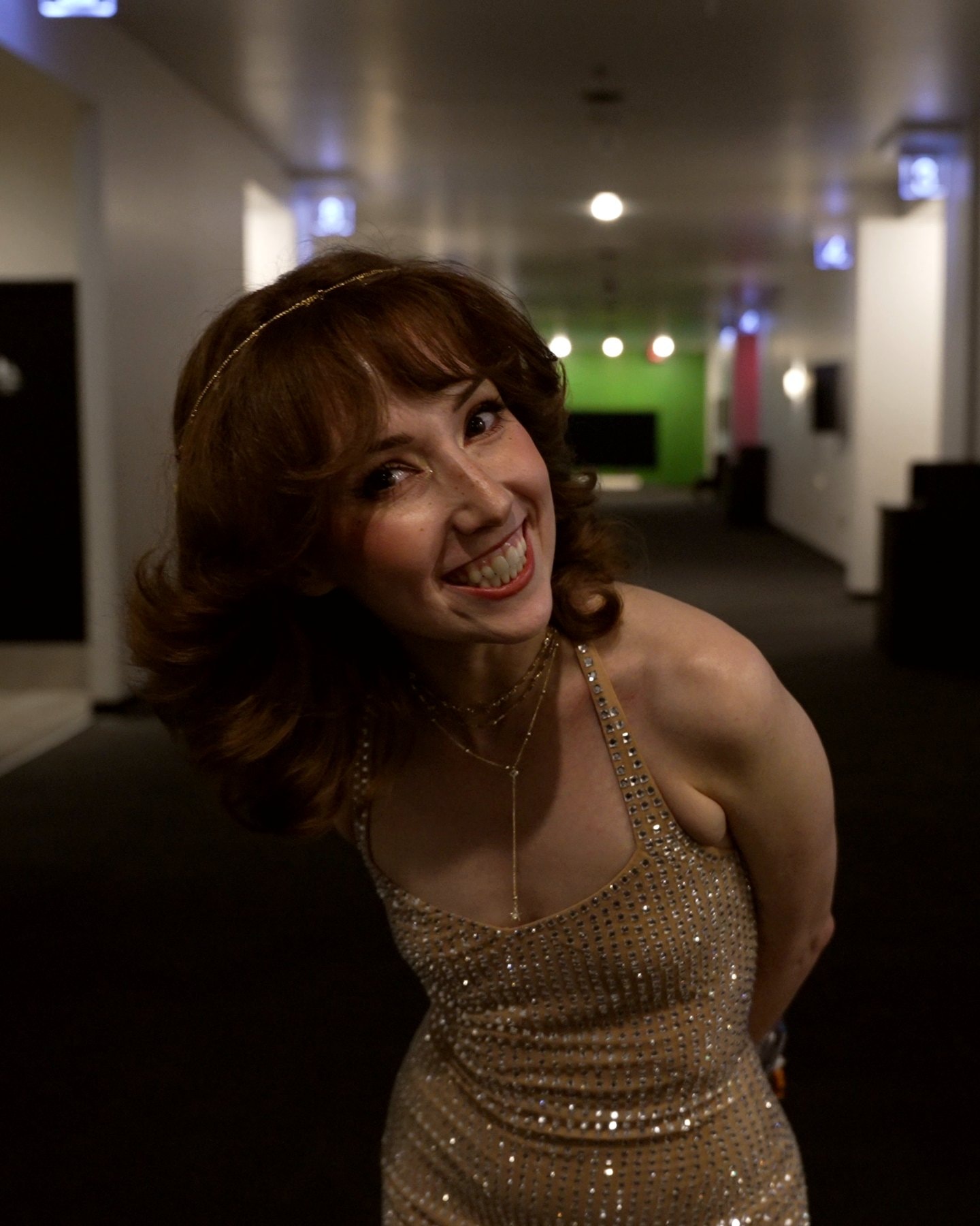 Hilly mugging for the camera in the venue hallway