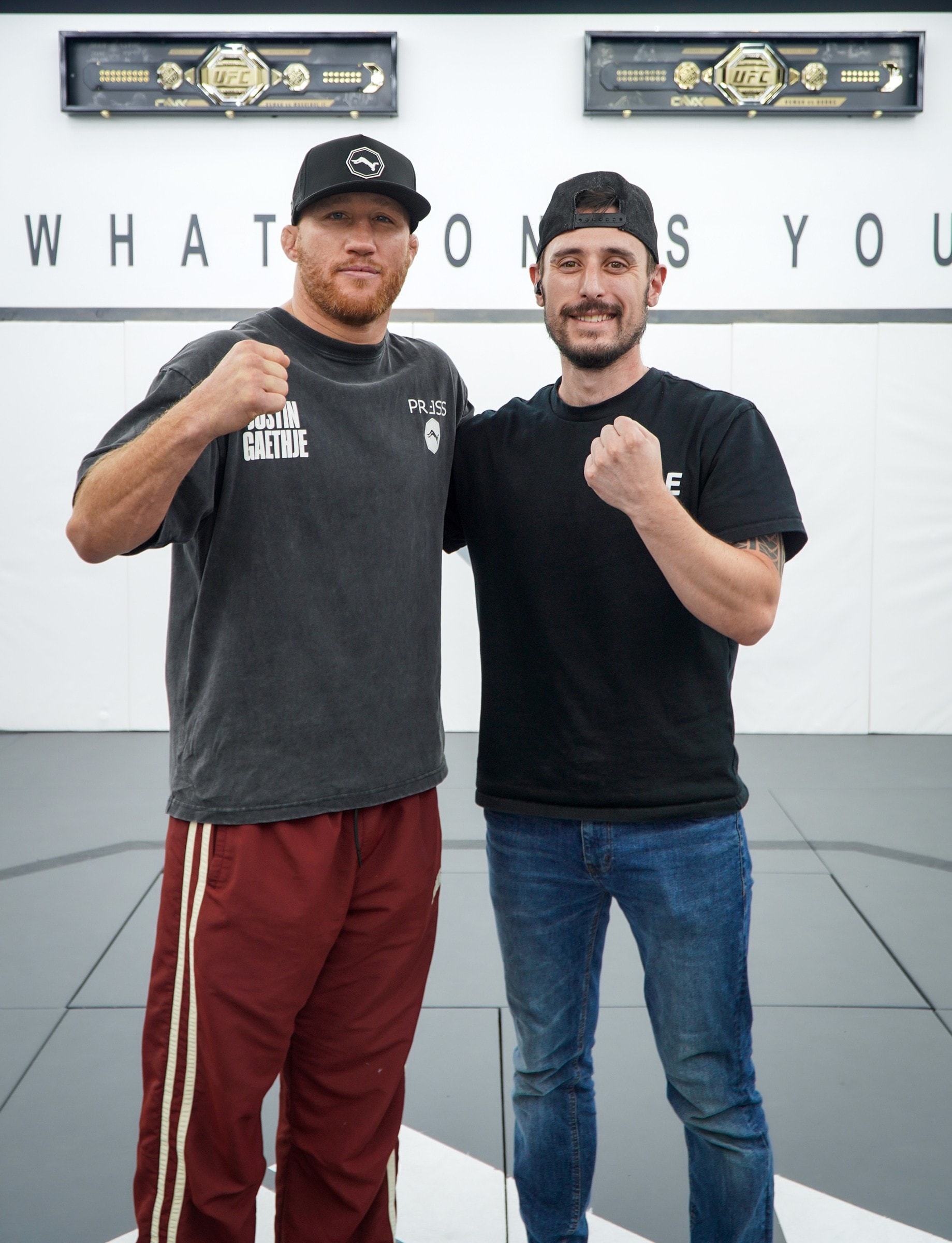 Garrett and Justin Gaethje with their fists up at ONX Sports