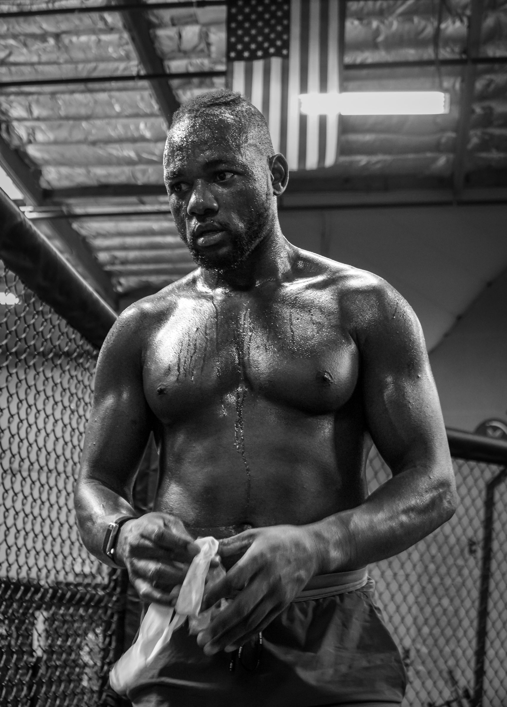 Black and white: Manel Kape unwrapping his hands in the cage