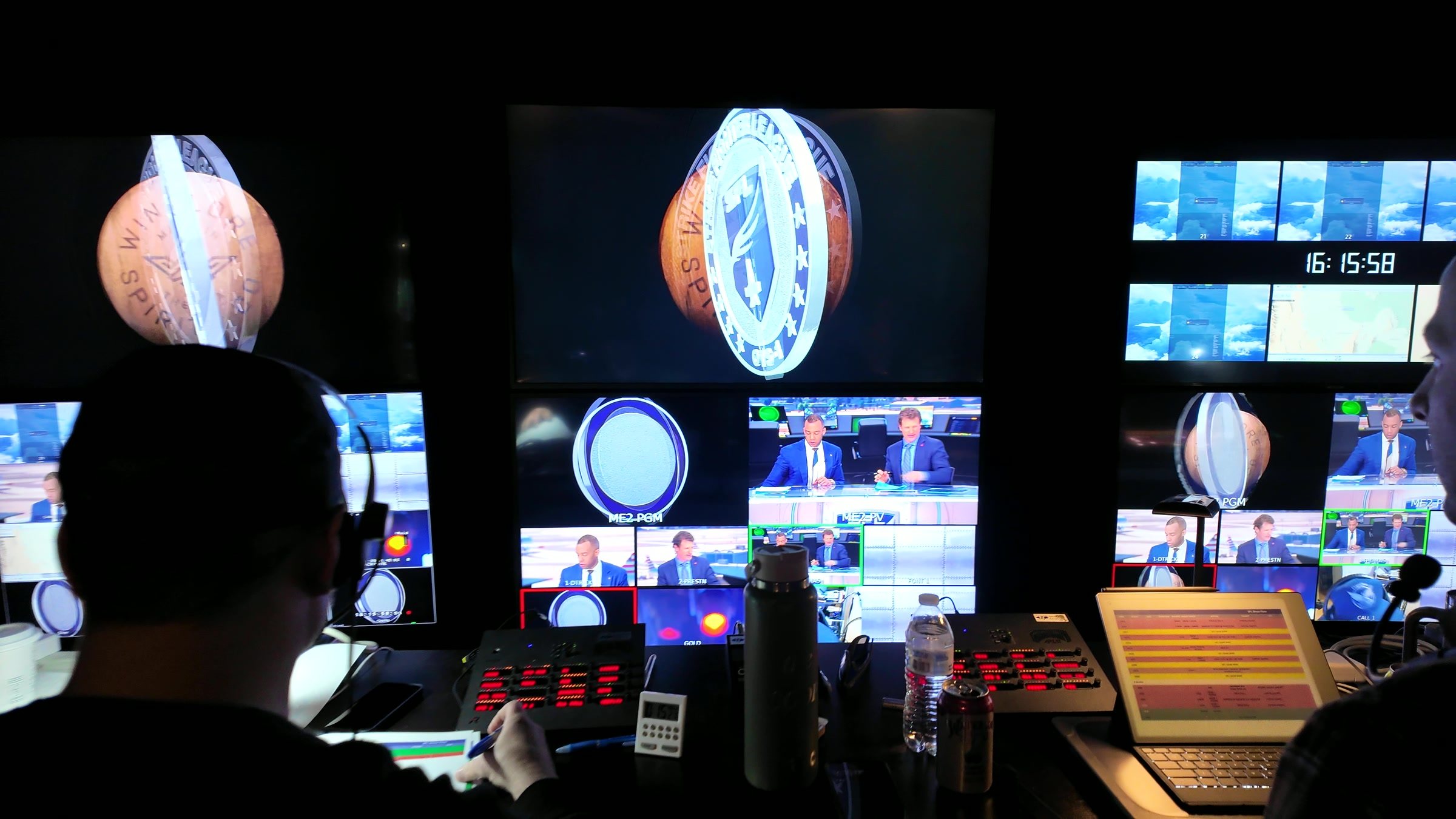 Graphics operator running planet and logo animations on the monitor wall
